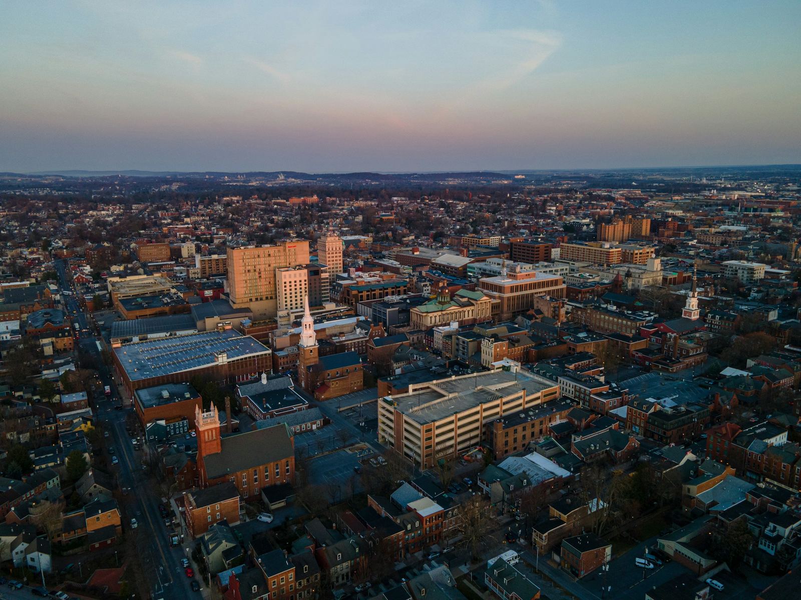 Aerial view of downtown Lancaster, PA and its rowhouse blocks at dusk